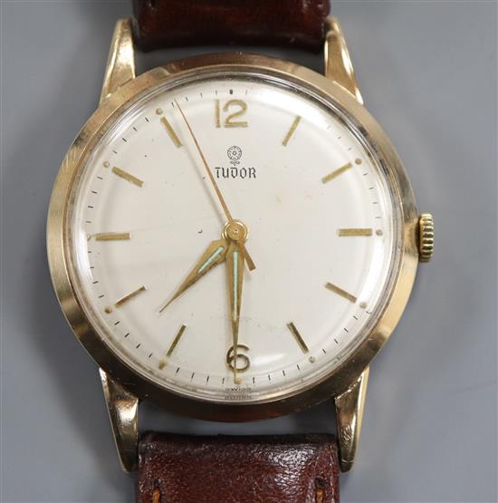 A gentlemans 1960s 9ct gold Tudor manual wind wrist watch, with later associated leather strap.